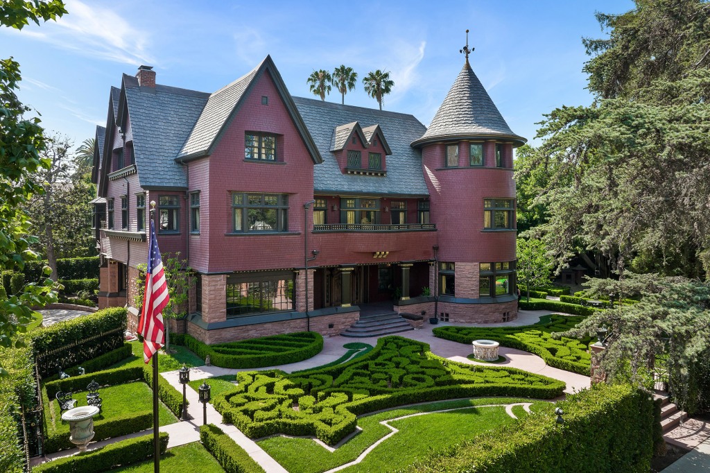 The Victorian house, with a striking tower, is located in a historic district of LA.