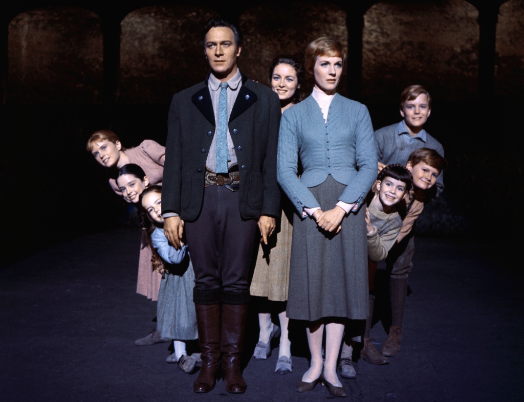 Julie Andrews and Christopher Plummer are flanked on all sides by their children, all members of the singing Von Trapp family, in this publicity flyer of the 1965 adaptation of the Rogers and Hammerstein musical, The Sound of Music.