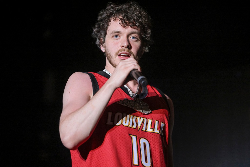 Jack Harlow performs in a red tank top.