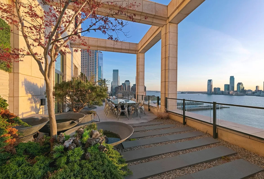 The property offers beautiful sunset views over the Hudson River and an expansive deck on each of the three levels.
