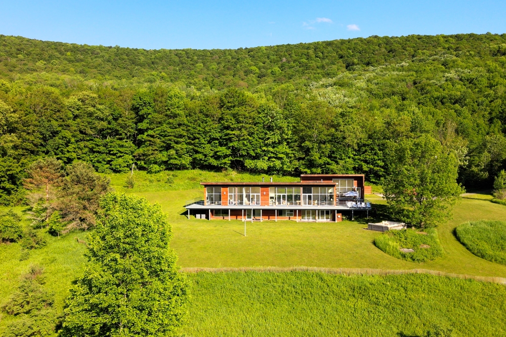 New York State's signature greenery surrounds the house.