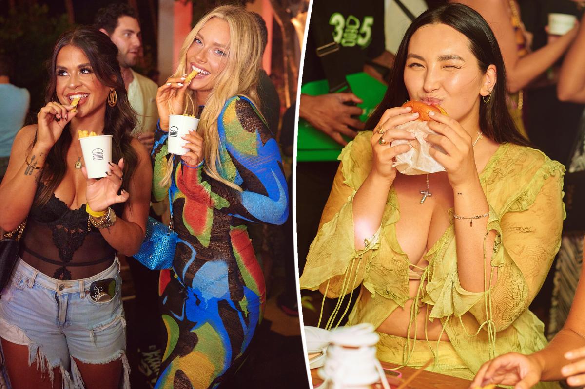 Models eat burgers after Sports Illustrated Swim Week show