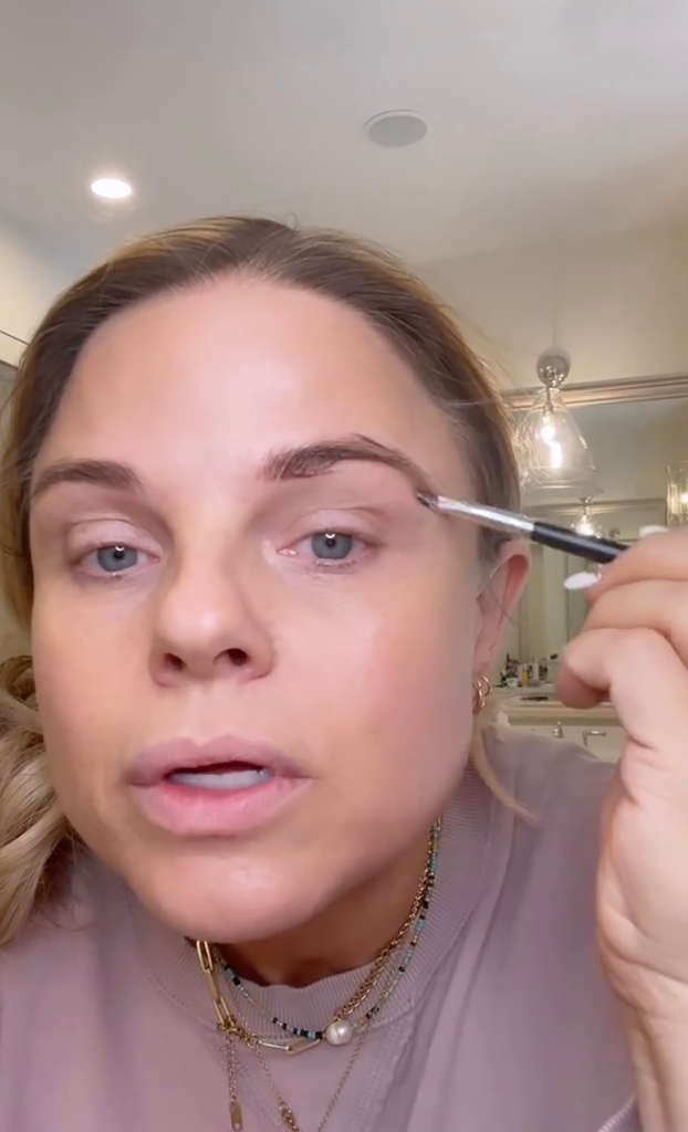 Lisa Wilson applying makeup.