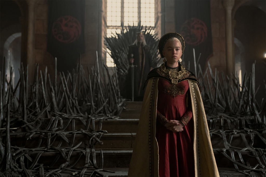 Princess Rhaenyra Targaryen (Milly Alcock) in the throne room with her father, King Viserys (Paddy Considine).