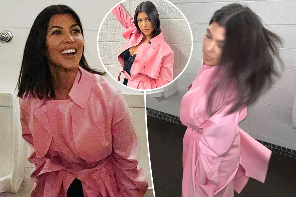 Kourtney Kardashian Models $3K Latex Coat In Men's Bathroom