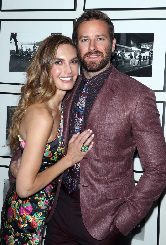 Elizabeth Chambers and Armie Hammer pose together.