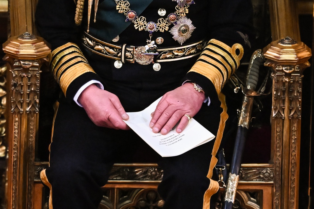Prince Charles, Prince of Wales holds the Queen's speech in his hands after reading it in the House of Lords Chamber during the State Opening of Parliament at the House of Lords at the Palace of Westminster on May 10, 2022 in London, England .