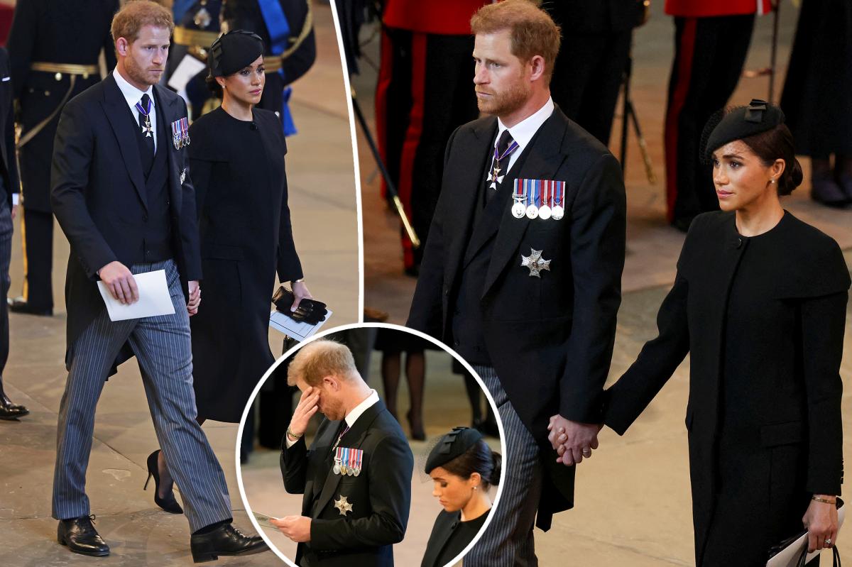 Meghan Markle holds Prince Harry's hand at Queen Elizabeth II's funeral