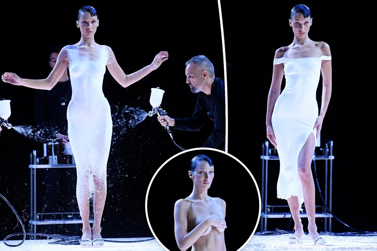 Bella Hadid gets dress sprayed during mid-fashion show